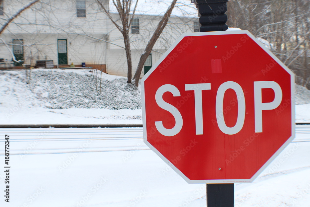 Stop sign on icy road Stock Photo | Adobe Stock
