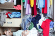 Wardrobe with messy clothes, closeup