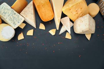 Wall Mural - Variety of cheese on dark background