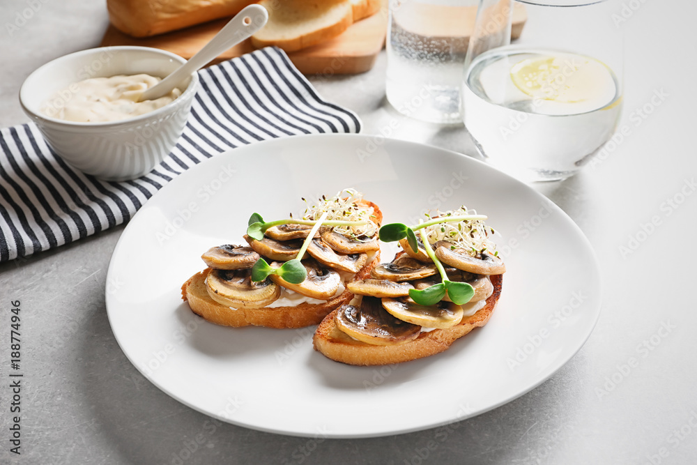 Tasty bruschettas with mushrooms on plate