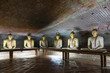 Group of sitting Buddha statues in cave buddhist temple
