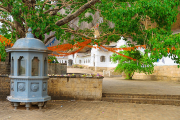 Wall Mural - Shrine near Holy bodhi ficus tree in the Dambulla Golden temple cave complex