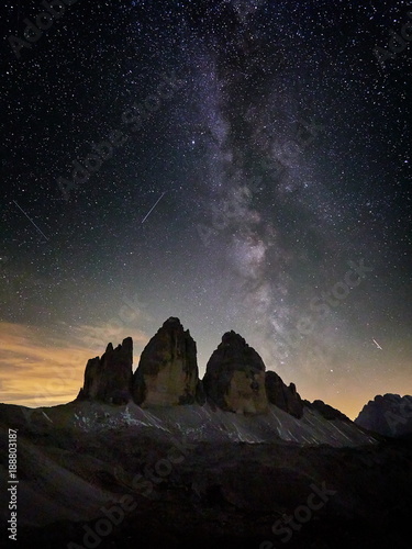 Fotografie, Obraz Alps Mountain landscape with night sky and Mliky way Tre Cime di Lavaredo, Dolom