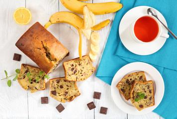 Canvas Print - banana bread on table with cup of tea