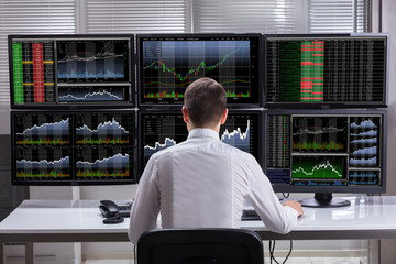 Poster - Stock Market Broker Analyzing Graphs On Computer Screens