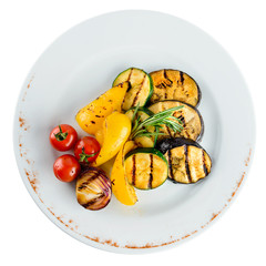 Canvas Print - Tasty baked eggplant with spices and tomato in a white plate on light background. Top view, flat lay