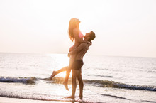 Couple In Love Having Romantic Tender Moments At Sunset On The Beach