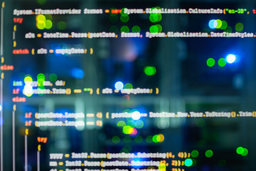 Leinwandbilder - Double exposure of Computer language source code on computer monitor and network server room with computers.