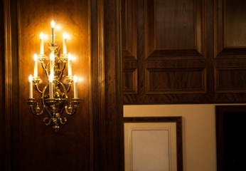 Wall Mural - Light as many candles in the classic interior of the hotel