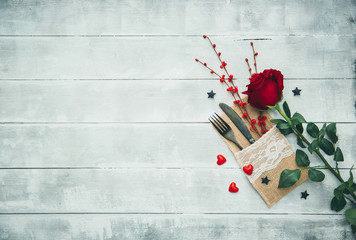 Wall Mural - Fork, knife, napkin, heart. Celebrate valentine's day. Serving, Table decoration Valentine's Day, table set with a decorative heart. Image of dinner on Valentines day. Top view, copy space.