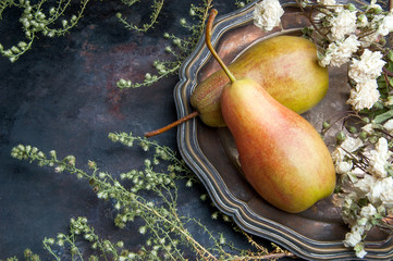 Two pears on black background