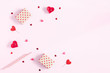 Valentine's Day. Frame made of gifts, candles, confetti on pink background. Valentines day background. Flat lay, top view, copy space