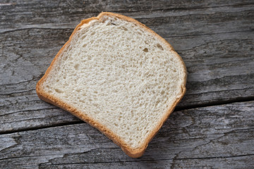 Wall Mural - Slice of bread on the gray table.