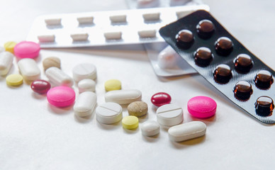 Wall Mural - Close-up of the pills on the white background, The drug and capsule pills on the floor, Pile of the drug and pills on the white background.