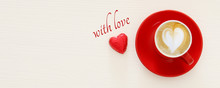 Valentine's Day Background. Red Cup Of Coffee With Heart Shape Foam And Chocolate. Top View Image.