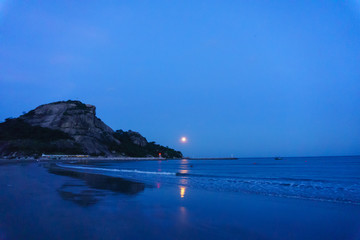 Wall Mural - panorama landscape view of seascape and skyline in the evening when full moon over the sea and mountain.