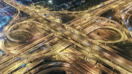 Wall Mural - Time lapse,Hyper lapse ,Of traffic on city streets at night. Expressway with car lots in the city in Thailand.  beautiful Street .Aerial view and top view of traffic on freeway, 4K.