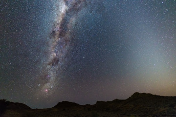 Wall Mural - milky way arch, stars in the sky, the namib desert in namibia, africa. the small magellanic cloud on