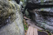 Trail among rock formations in so called Errant Rocks in Table Mountains, Sudetes in Poland