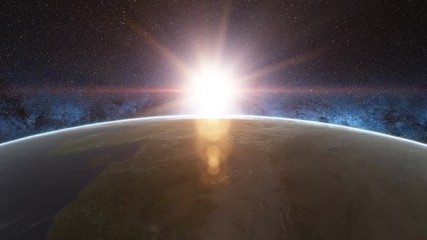 Wall Mural - beautiful sunrise view from space on planet earth. world close up rotating in universe of blue sky s