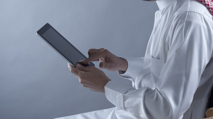 Saudi Arabian Man Hands Holding Tablet