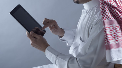 Saudi Arabian Man Hands Holding Tablet