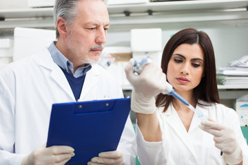 Poster - Scientist at work in a laboratory