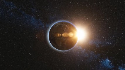 Wall Mural - sunrise view from space on planet earth and sun. world rotating on its axis, milky way star in backg