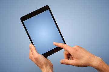 Female hand holding tablet