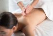 © Yakobchuk Olena - Close up of young woman back getting massage at beauty salon. Masseuse palms pampering skin with gentleness