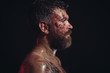 © Volodymyr - Man with bloody beard on brutal face profile