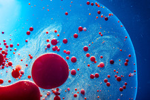 Red Bubbles Of Blood Cells On Blue Background Closeup. Abstraction Of Medicine. Concept Of Micro Processes And Diseases