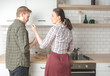 © Sergey Chumakov - young regular couple cooking at home kitchen together
