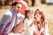 © ivanko80 - Young family with child  having fun in nature.