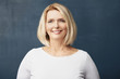 © gzorgz - Confident mature woman posing in studio. Portrait shot