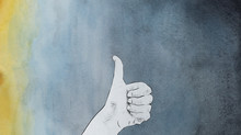 Human Hand Giving The Thumbs Up Sign