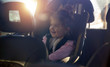 © Lucky Fenix - car child seat- smiling girl in her car seat.