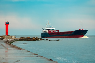 Blue cargo ship underway