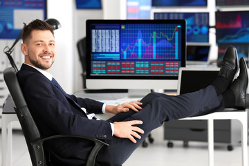 Poster - Young stock exchange trader at workplace