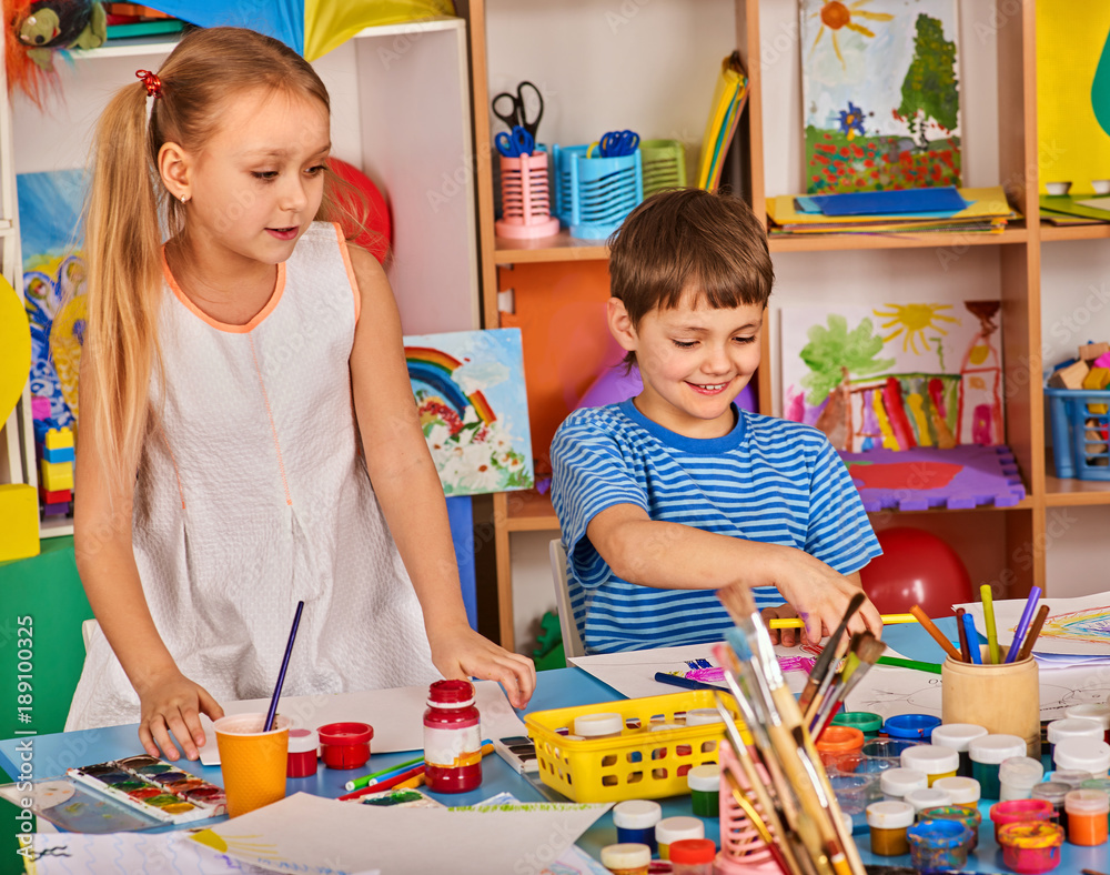 Small students girl and boy painting in art school class. Child drawing ...