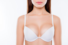 Cropped Close Up Photo Of Sexy Woman's Breast Wearing White Classic Elegant Brassiere She Has Clean Clear Sensual Fresh  Pure Skin, Skinny Slim Slender Body Isolated On Background
