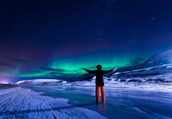 Wall Mural - the polar arctic northern lights aurora borealis sky star in norway svalbard in longyearbyen city to