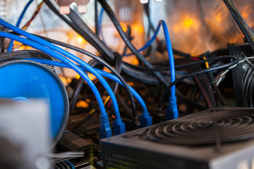 Fototapete - Close-up equipment for mining crypto-bitcoin, ether. Video cards, motherboards, blue lights
