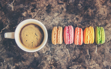 Macaroons and coffee. Breakfast. Selective focus. 