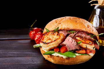 Wall Mural - Gourmet Surf and Turf burger with beef and scampi