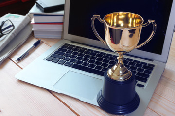 Wall Mural - trophy on working table , winner concept.