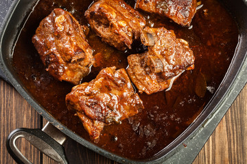 Canvas Print - Pork spare ribs on dish in own sauce