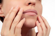 © mantia82 - Healthy lips closeup without makeup. Hands show beautiful closed mouth without lipstick. Nails without nail-varnish polish. Beauty. Face without cosmetics on white background.