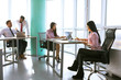 © Svyatoslav Lypynskyy - Businesspeople working as a team in office. Analyze papers and charts of new strartup. Business concept.