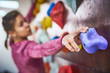 © sandsun - sporty woman in boulder climbing hall. focus on a hand